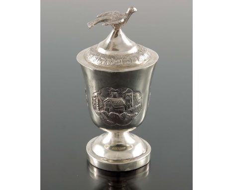 A Chinese export silver egg cup and cover, TM circa 1930, footed urn form, repousse decorated with scalloped vignettes of pla