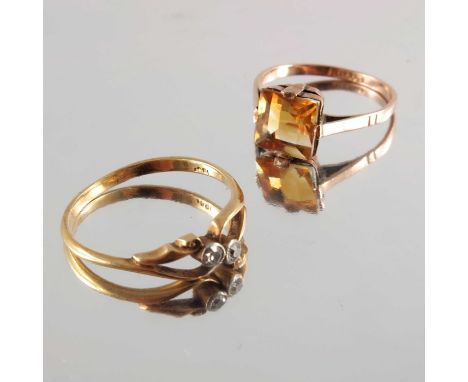 Two mid 20th century gold gem-set rings, including an 18ct gold single-cut diamond two-stone ring and a 9ct gold citrine sing