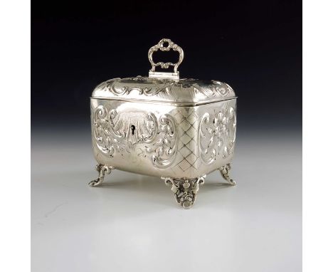 An Austrian silver tea caddy, AW, Vienna circa 1870, rounded cuboid form, embossed with Rococo scrolls and feathered shell mo