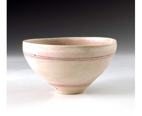 † Dame Lucie Rie (1902-1995), a studio porcelain bowl, circa 1971, ogee form, inlaid concentric bands of pink through a white