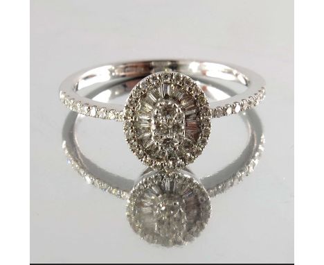 An 18ct gold brilliant and baguette-cut diamond cluster ring, estimated total diamond weight 0.40ct, G-H colour, SI clarity, 