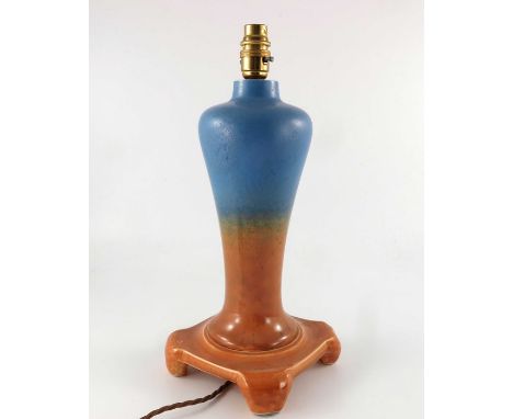 A Ruskin Pottery Crystalline lamp base, circa 1932, inverse elongated baluster form on a square bracket footed base, blue dra