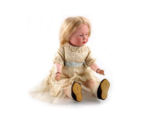 A Kammer &amp; Reinhardt bisque head doll circa 1909, 'Marie', 101, blue intaglio eyes, closed mouth, blonde mohair wig, and 