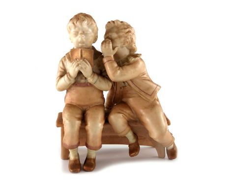 James Hadley for Royal Worcester, a blush ivory figure group, Goldsmith's Boys, modelled on a bench, with gilt verse 'The Bus