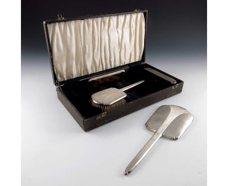 A George VI silver backed brush and mirror set, Charles S Green and Co., Birmingham 1939, engine turned in the Art Deco style