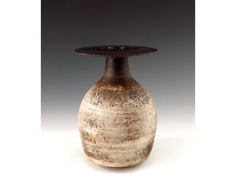 † Hans Coper (1920-1981), a studio pottery stoneware bottle vase, 1964, shouldered ovoid form with flat wide brim disc rim, o