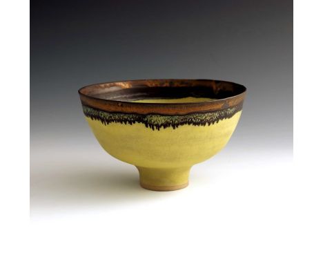 † Dame Lucie Rie (1902-1995), a studio pottery bowl, circa 1983, ogee form, yellow glazed earthenware with manganese golden l