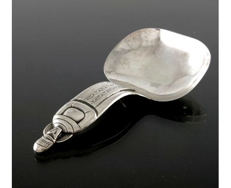 A Finnish Modernist silver caddy spoon, Koruteollisuus Tillander Oy, Helsinki 1949, the handle cast and chased as a stylised 