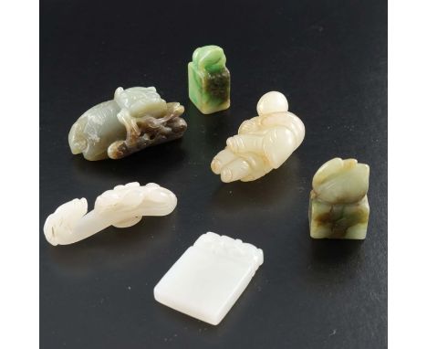 Six Chinese hardstone carvings, including two seals with frog and goose, a mutton fat jade belt hook and plaque pendant, figu
