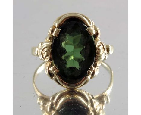 An oval-shape green tourmaline single-stone ring, with floral shoulders, stamped 585, approximate ring size K, 3.1g