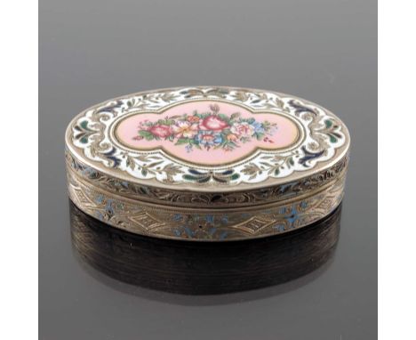 A silver and enamelled snuff box, 19th century, oval form, the lid with champleve and painted enamel foliate scroll design an