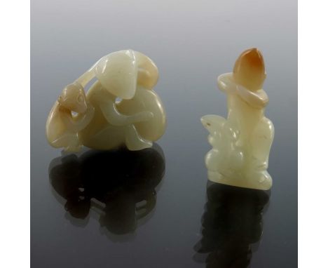 Two Chinese jade carvings, modelled ass two monkeys with a peach, the other with two rats, 4cm (2)