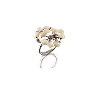 An 18ct gold mother-of-pearl and diamond floral dress ring, total diamond weight 0.90ct, engraved to band, estimated H-I colo