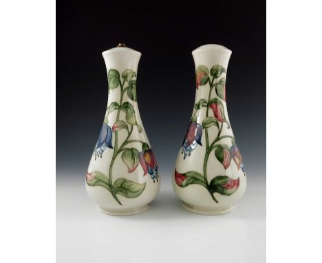 Walter Moorcroft, a pair of Fuchsia lamp bases, circa 1950s, baluster form, impressed marks, 32.5cm high (2)
