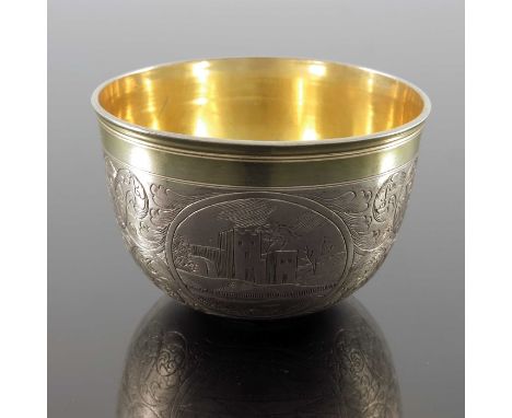 An Austrian silver and parcel gilt beaker, Johannes Sottenreich, Vienna 1712, rounded tumbler form, engraved with three pasto