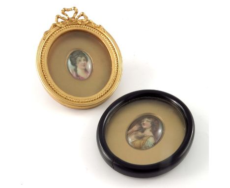 Leslie Johnson for Royal Doulton, two portrait plaques, painted with a flapper and Aristocrat, signed, 5cm x 3.5cm, framed (2