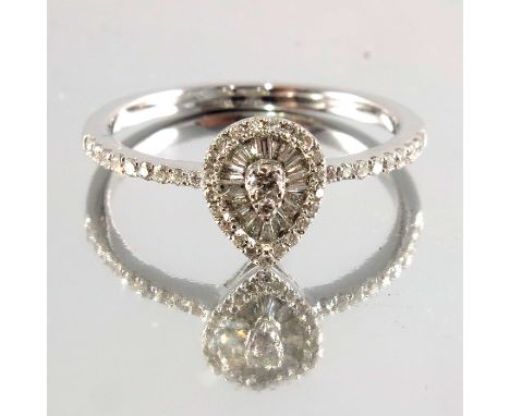 An 18ct gold brilliant and baguette-cut diamond cluster ring, estimated total diamond weight 0.40ct, G-H colour, SI clarity, 