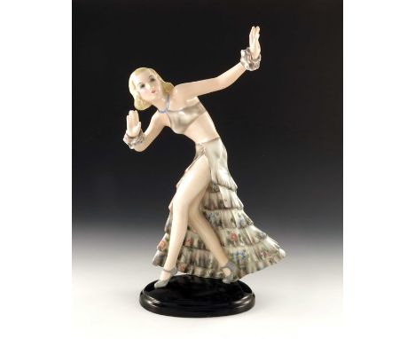 Josef Lorenzl for Goldscheider, female dancer in tiered skirt, model 7058, designed circa 1934, impressed signature to base, 