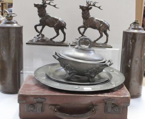 A pair of early 20th century bronzed stags, each on a rectangular stylised rocky plinth base, height 19cm, two early 20th cen