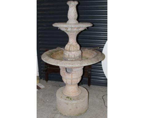 A large stoneware circular two-tier garden fountain in the Classical style, on a circular base, height 155cm, diameter of lar