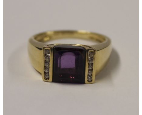 A 9ct yellow gold ladies' dress ring with central emerald-cut amethyst with small white stone surround, size Q, approx 6.3g.