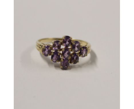 A 9ct yellow gold ladies' dress ring, marquise-set with small amethysts, size Q, approx 2.3g.