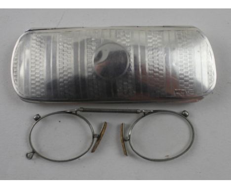 S W Goode &amp; Co; a George V hallmarked silver spectacles case with vacant cartouche and engine-turned detail, with blue ve