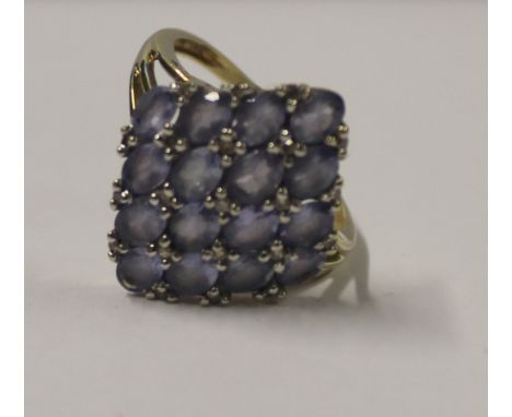 A 9ct yellow gold ladies' dress ring, diamond-shaped top set with lilac and white stones, size L, approx 3.1g.