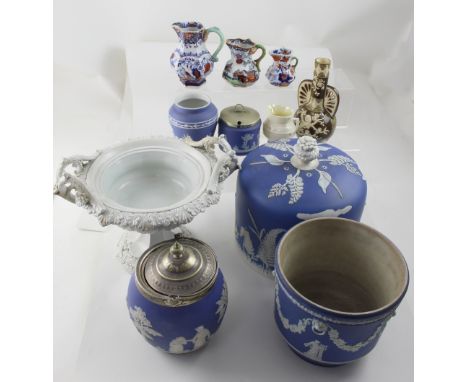 A group of early 20th century Wedgwood and other blue Jasper ware to include planter, baluster vase, biscuit barrel and the c