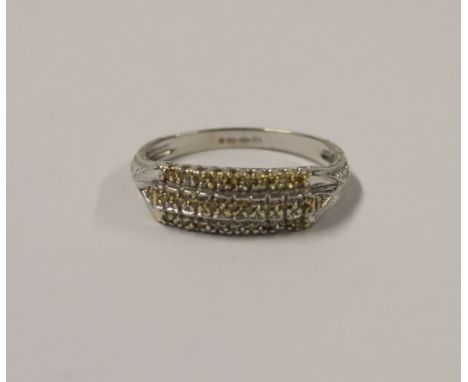 A 14ct white gold ladies' dress ring, platform-set with small yellow diamonds, size R, approx 3.5g.