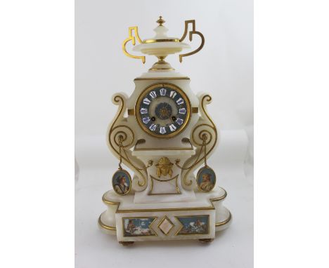 A late 19th century French-style eight-day ornate alabaster mantel clock, twin-handled urn decoration above blue painted and 