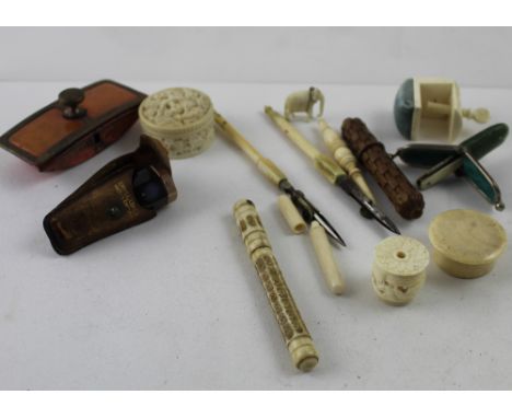 A quantity of late 19th/early 20th century ivory items to include tape measure, table clamp pincushion, small trinket pots, t