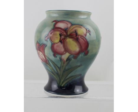 A Moorcroft freesia pattern baluster vase, blue marks to base,  height approx 14.5cm.