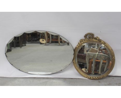 Two vintage mirrors, one a c1940s style example, width 74cm and the other a circular gilded example width 40cm (2).