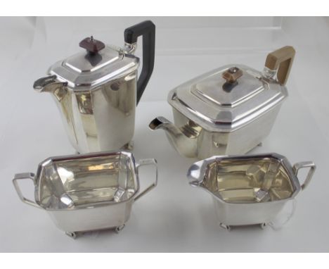 A George VI hallmarked silver four-piece tea service, teapot, hot water pot, milk jug and sugar bowl, Harrison Brothers &amp;