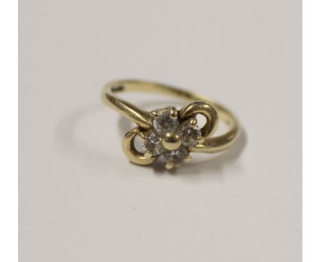 A yellow gold ladies' dress ring, floral and bow setting with four white stones, size L, approx 2.9g.