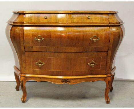 A David Phipp walnut inlaid commode in the French style, two frieze drawers above two larger drawers, to carved frieze on car