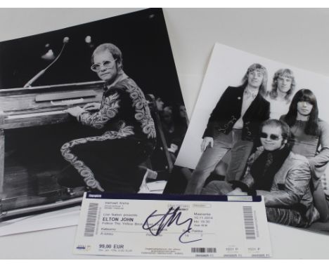 A Harry Goodwin portrait of Elton John, 12 x 9.5ins format, a picture of Elton John and backing band, 10 x 8ins and a signed 