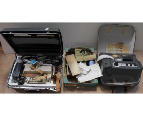 A group of medical instruments to include an Aldomet calibration tool, a Mini Wright Peak Flow Meter, a boxed blood pressure 