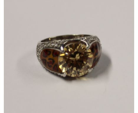 A 9ct gold ladies' dress ring set with citrine, leopard print style shoulders and small diamond surround, size R, approx 9.4g