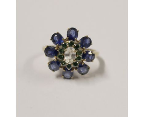 A yellow metal ladies' dress ring, floral-set with central white stone topaz and small diamonds, size S, approx 4.4g.