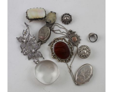 A quantity of hallmarked silver and white metal jewellery and other items to include a link bracelet, silver napkin ring, bro