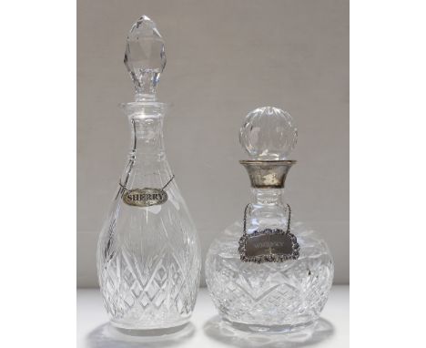 Two non-matching decanters, one with hallmarked silver collar for 'Caldy Pro-Am 1994' with a hallmarked silver 'Whisky' label