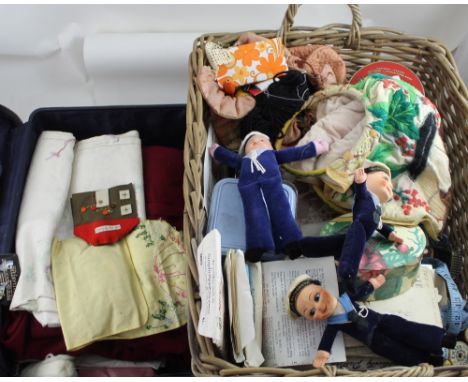 A wicker rectangular twin-handled basket containing a large quantity of vintage sewing aids to include threads, buttons, patt