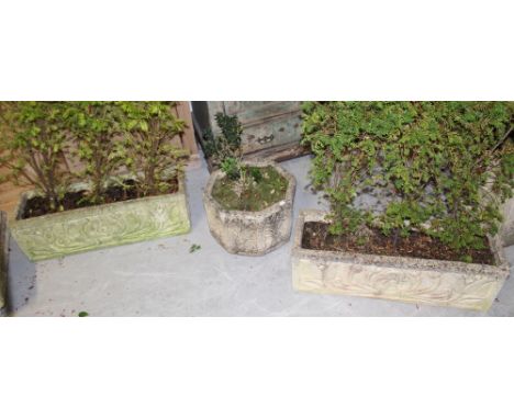 A pair of rectangular composite stone garden troughs in the Classical style, with greenery, height 27cm, length 80cm and an o