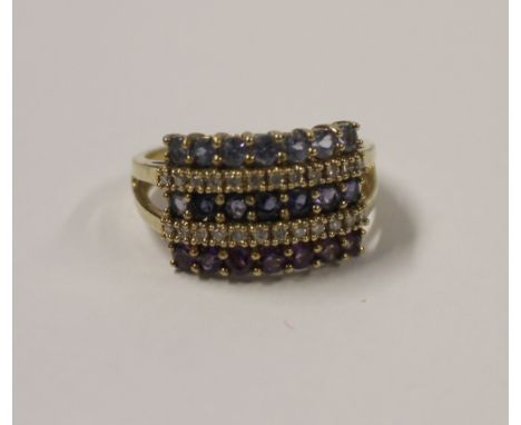 A 9ct yellow gold ladies' dress ring, platform-set with five lines of multicolured amethyst and white stones, size T, approx 