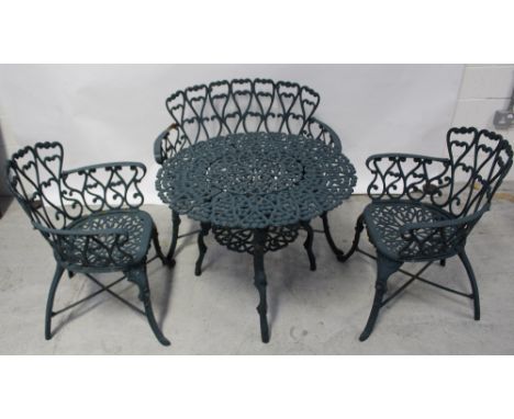 A green painted cast iron circular garden table with lower shelf to outswept cabriole supports, diameter 76cm, a two-seater m