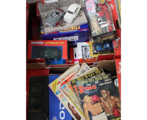 A group of boxed model vehicles to include a Marvel Spiderman Corvette, a Corgi 1960s DC Comics Batmobile and a number of vin