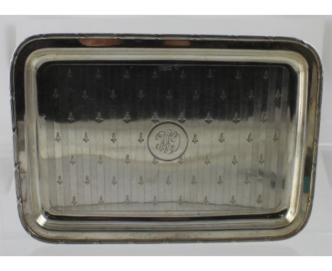 A George V hallmarked silver engine turned rectangular tray with chased fleur-de-lys decoration, J, Richard Attenborough &amp