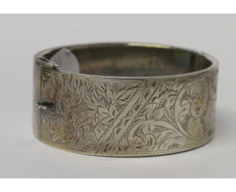 A hallmarked silver engraved cuff bangle, approx 1ozt.